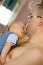 Father holding sleeping baby Royalty Free Stock Photo