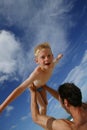 Father holding son overhead Royalty Free Stock Photo