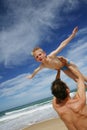 Father holding son by the shore Royalty Free Stock Photo