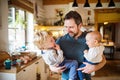 Father with two toddlers at home.