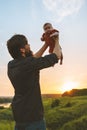 Father holding up baby outdoor happy family lifestyle Royalty Free Stock Photo