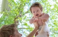 Father holding up his happy baby boy Royalty Free Stock Photo