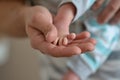Father holds baby feet in hands Royalty Free Stock Photo