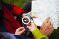 Father holds the card, a child holding a compass. Royalty Free Stock Photo