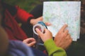 Father holds the card, a child holding a compass. Royalty Free Stock Photo