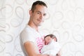 Father holds the child. Father holds his young child in a towel on his hand Royalty Free Stock Photo