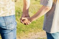 Father holds daughter's hand on blurred nature background. Father's day concept, soft focus Royalty Free Stock Photo