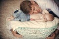 Father hug basket with baby son asleep Royalty Free Stock Photo