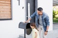 father hugging daughter near empty mailbox