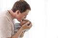 Father hugging and kissing his newborn child Royalty Free Stock Photo
