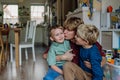 Father hugging and kissing son's cheeks. Concept of Father's Day, and fatherly love. Royalty Free Stock Photo