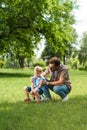 father hugging and supporting crying son after playing football Royalty Free Stock Photo
