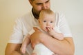 Father hugs and kisses his cute adorable newborn baby Royalty Free Stock Photo