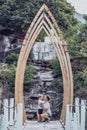 Father hugs son sitting under arch Buddhist temple Imitation. Idyllic harmony family relationship psychology, father