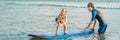 Father or instructor teaching his 4 year old son how to surf in the sea on vacation or holiday. Travel and sports with