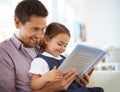 Father, kid with book for reading and knowledge, happy with bonding at home and storytelling for education. Man, young Royalty Free Stock Photo