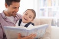 Father, kid and reading book for fairytale, happy with bonding at home and knowledge for education. Man, young girl and Royalty Free Stock Photo