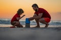 Father and kid son build sand castle at the summer beach, Kid and father building sandcastle. Father and child son Royalty Free Stock Photo