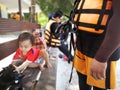 Father and kid waiting for a speedboat trip in a tropical island.