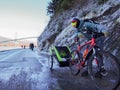 A father and kids in bike trailer at seawall bike trail in Stanley Park in winter
