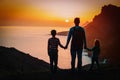 Father with kids-boy and girl- travel in sunset mountains, family travel Royalty Free Stock Photo