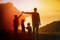 Father with kids-boy and girls- travel in sunset mountains, family travel Royalty Free Stock Photo