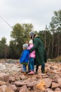 father and kids fishing together