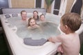 A father and kids in hot tub Royalty Free Stock Photo