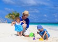 Father and kids making sand castle at tropical Royalty Free Stock Photo