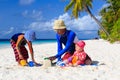 Father and kids making sand castle at tropical Royalty Free Stock Photo