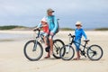 Father and kids riding bikes Royalty Free Stock Photo
