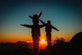 Father with kids travel in sunset mountains, family hiking in nature Royalty Free Stock Photo