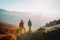 Father with kids travel in sunset mountains, family hiking in nature Royalty Free Stock Photo