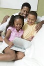 Father With Kids Watching Movie On Portable DVD Player Royalty Free Stock Photo