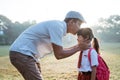 father kiss her daughter forehead when taking her to school in the morning Royalty Free Stock Photo