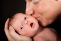 Father kissing baby