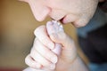 Father kissing foot of newborn baby. Royalty Free Stock Photo