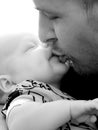Father kissing his baby Royalty Free Stock Photo