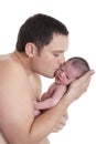 Father kissing his newborn baby Royalty Free Stock Photo