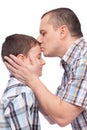 Father kissing his son on the forehead Royalty Free Stock Photo