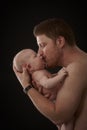 Father kissing newborn baby Royalty Free Stock Photo