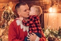 Father kissing son. Winter holidays concept. Magic atmosphere family holidays. Fatherhood joy. Enjoy every moment with Royalty Free Stock Photo
