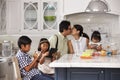 Father Leaving For Work After Family Breakfast In Kitchen Royalty Free Stock Photo