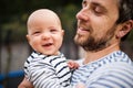 Father with little baby, summer day.