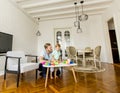 Father and little boy playing with toys in the room Royalty Free Stock Photo