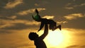 Father and little child play, laugh and hug together. Dad throws up a happy daughter in blue sky. Happy family travels Royalty Free Stock Photo