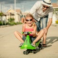 Father and little daughter playing near a house Royalty Free Stock Photo