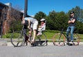 Father and little daughter riding a bike and another male biker waiting at the traffic lights in Montreal, Quebec, Canada