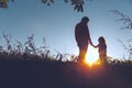 Father with little daughter walk in sunset Royalty Free Stock Photo