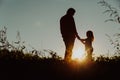 Father with little daughter walk in sunset Royalty Free Stock Photo